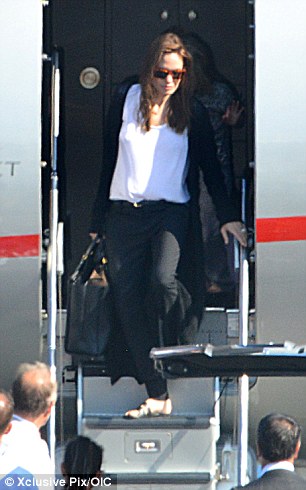 Arrivals: The couple landed in Nice on Saturday for their wedding on the same day